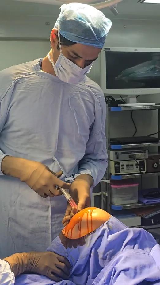 Dr. Manu Bora preparing a subchondral knee procedure